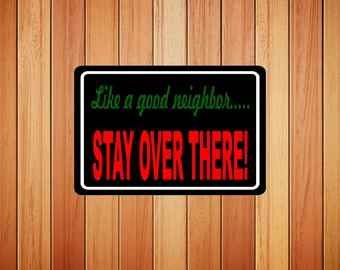 Like A Good Neighbor Stay Over There Metal Novelty Sign